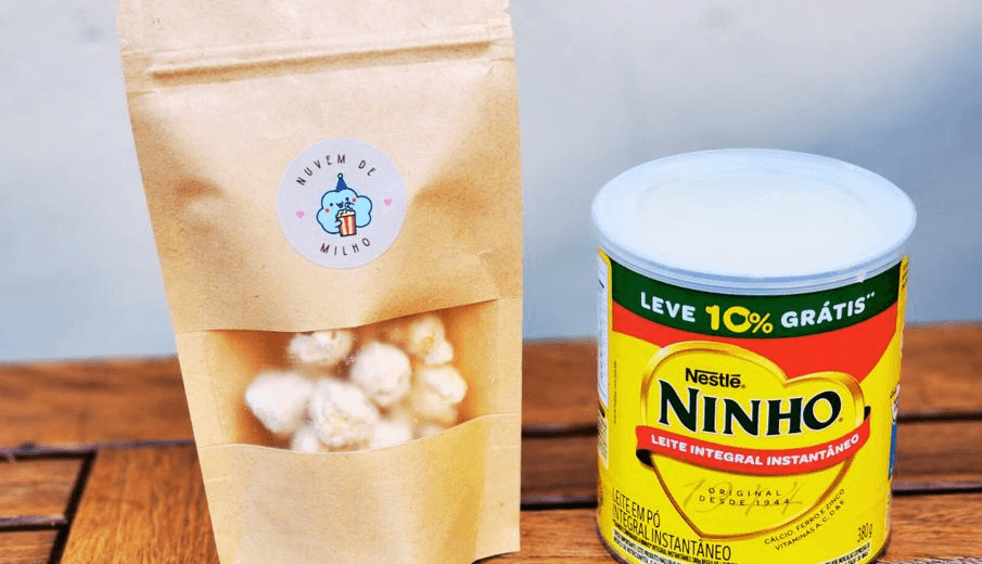 Pote de pipoca gourmet Nuvem de Ninho — Caramelo, chocolate branco e empanada no leite ninho.
